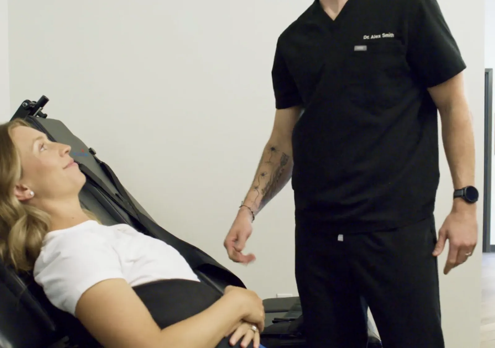 Patient receiving spinal decompression treatment on a specialized traction table