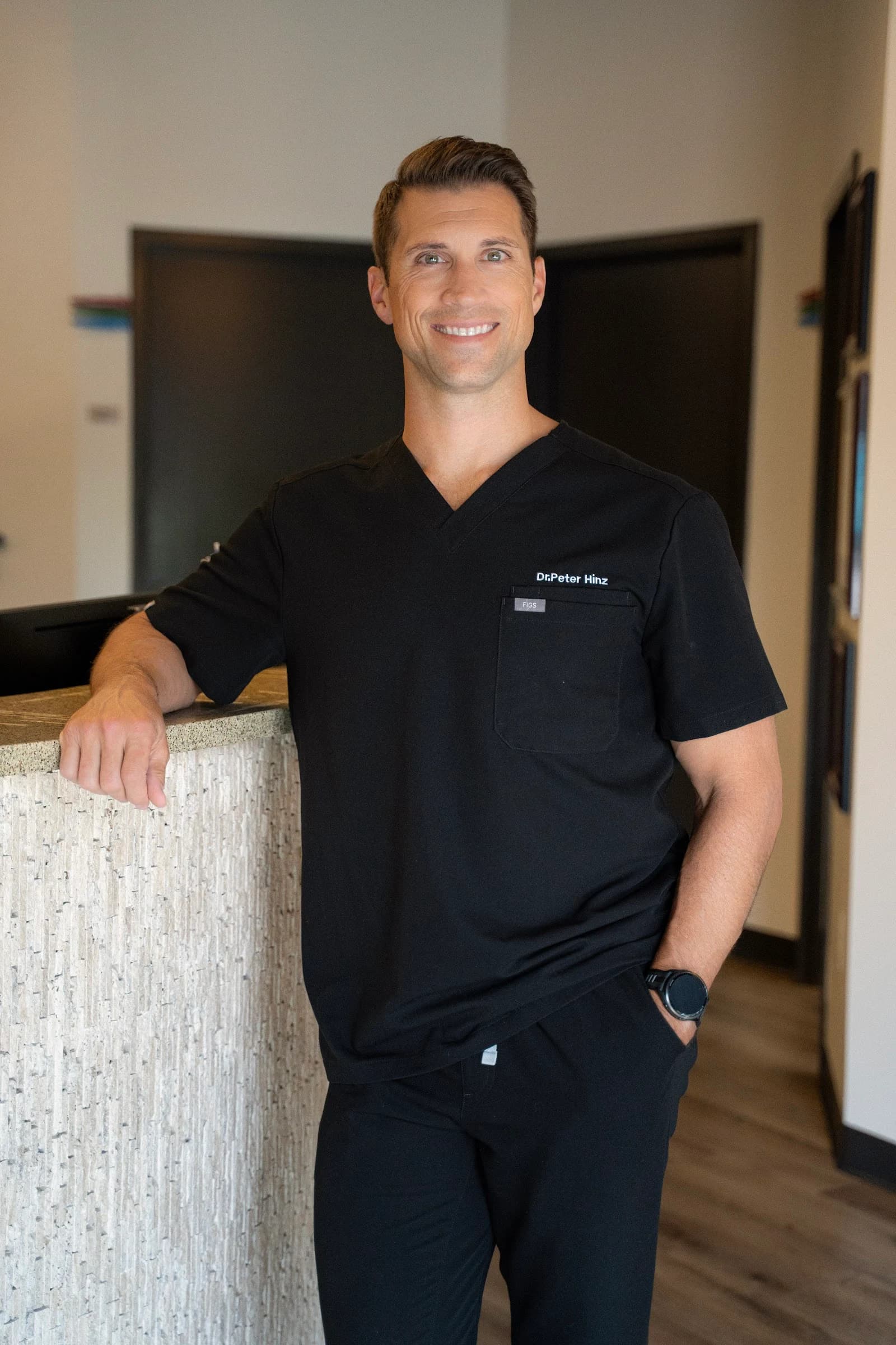 Dr. Peter Hinz standing at his workstation at Cool Springs Chiropractic